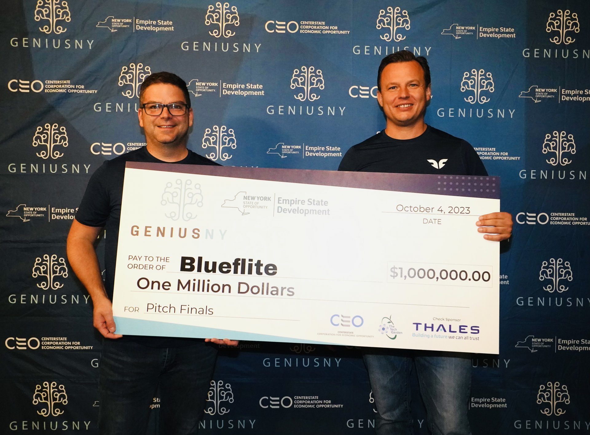 Blueflite co-founders James McClearen and Frank Noppel with the GENIUS NY $1 million grand prize check.